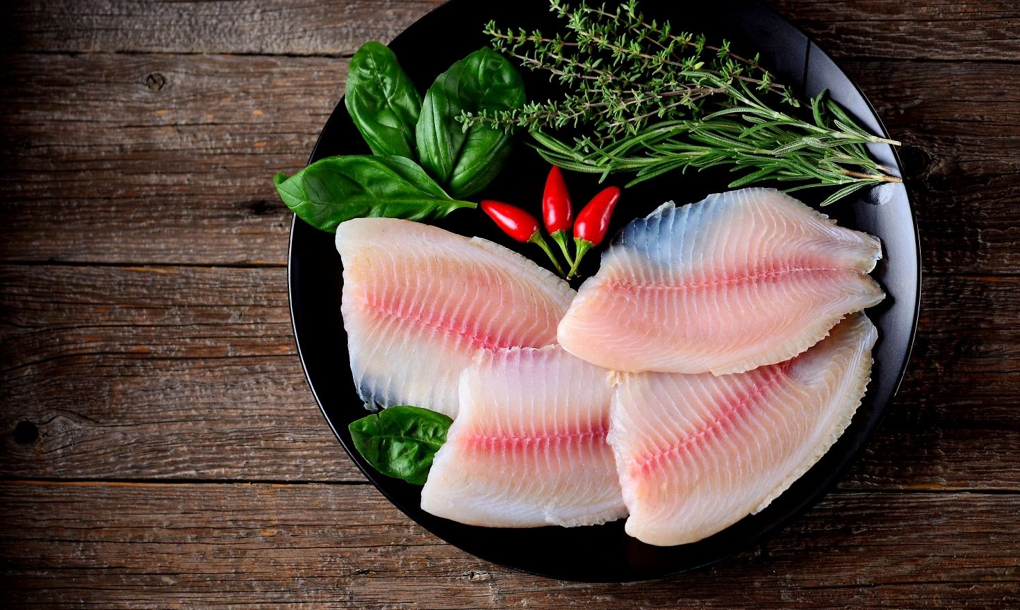 Fresh tilapia fillets with herbs